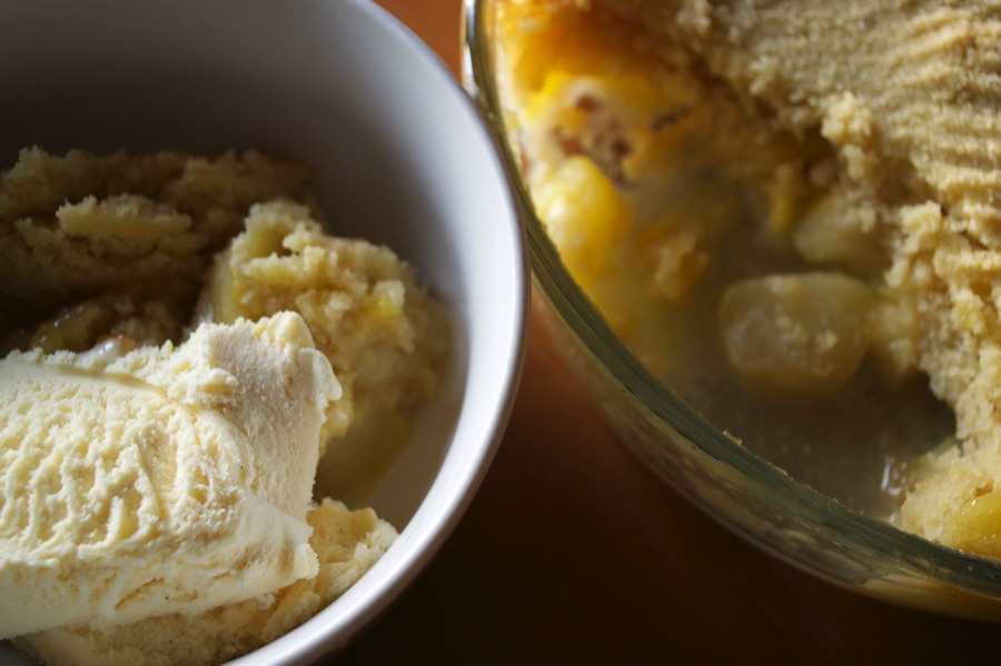 Bowl of pear crumble with ice cream